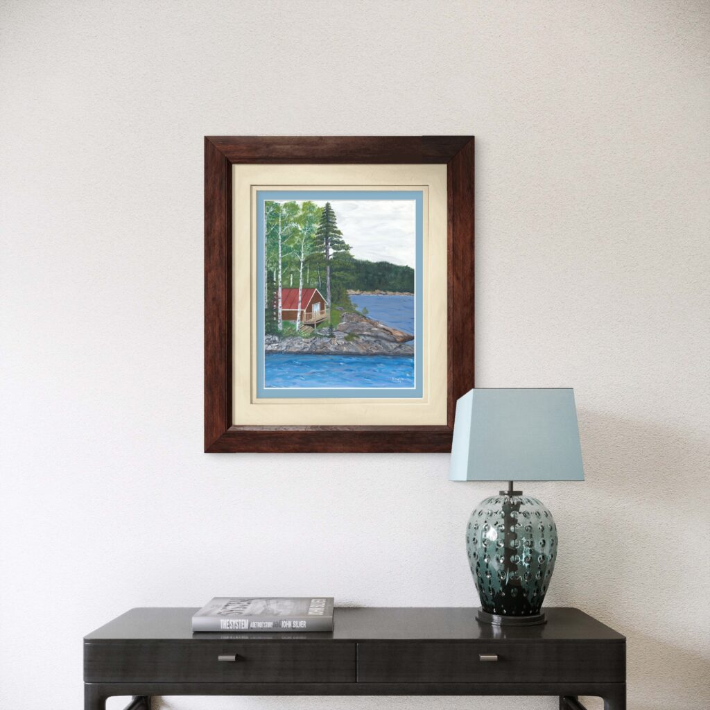 Print of an original acrylic painting of a red cabin beside a peaceful pond surrounded by nature, inspired by the tranquil beauty of Newfoundland.